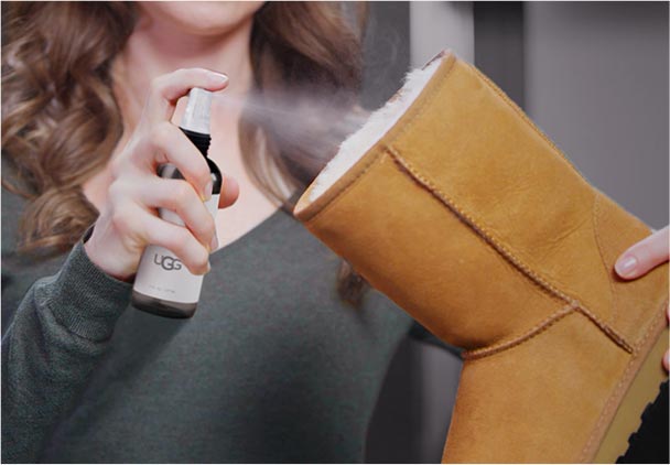 Woman brushing an UGG Classic