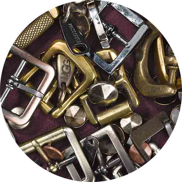image of belt buckles, buttons, and zippers
