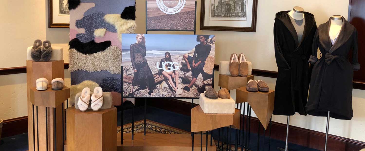 A display off UGG merchendise with a campaign photo stand in the middle.