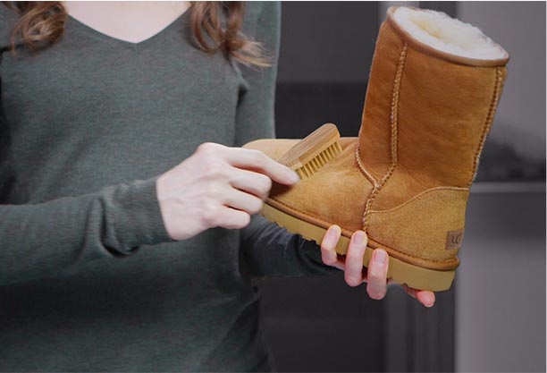 woman brushing suede classic