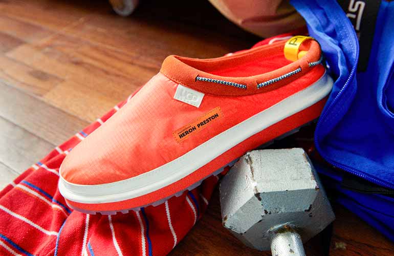 Close-up of the UGG X HP Tasman in orange.