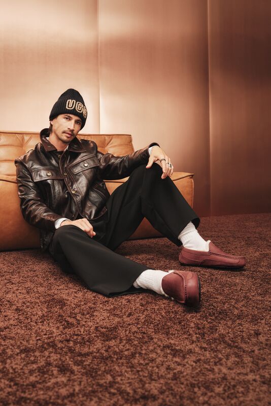 A man sitting wearing our UGG Men's Ascot Tumbled.