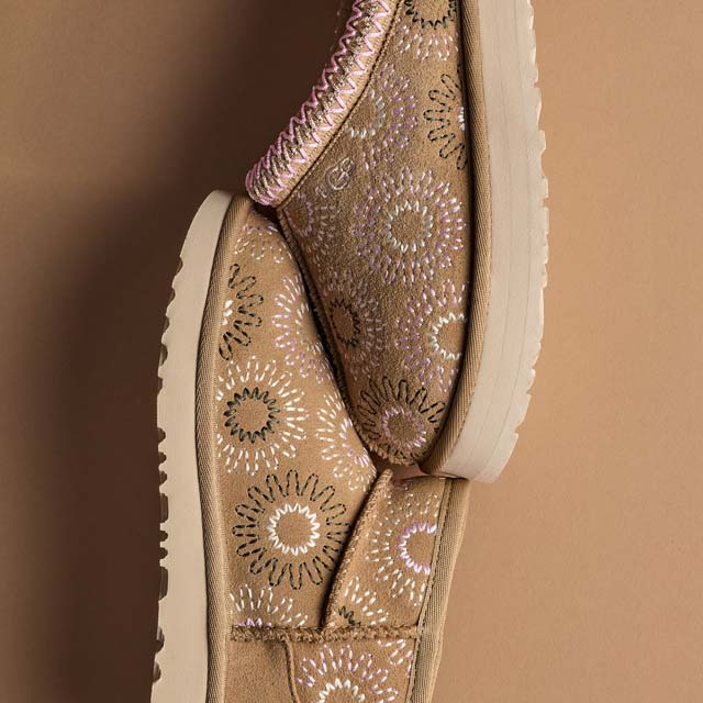 A kids' Tazz Sun Stitch and a kids' Classic Ultra Mini Sun Stitch on display against a tan background.