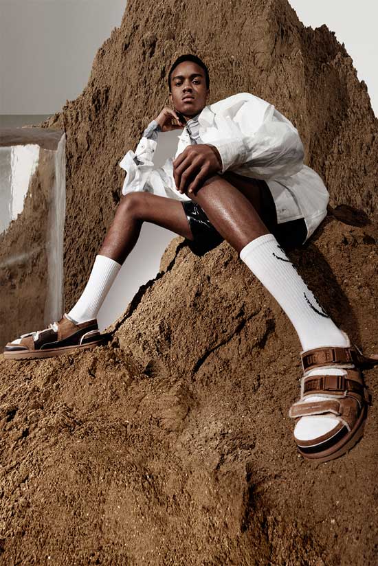 Model on a mound of dirt and block ice wearing UGG boots by Feng Chen Wang.